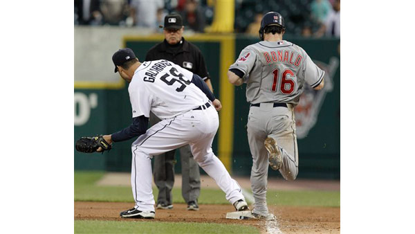 An umpire mistakenly called the runner safe here, ending what would have been a perfect game for pitcher Armando Galarraga.  But Galarraga stayed calm, and the ump later apologized.