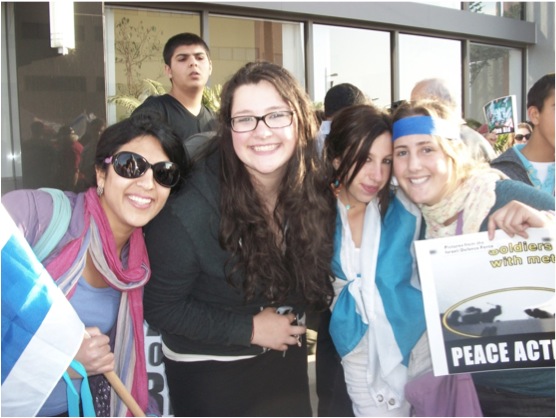 This years bat ami, Aviya Cohen, left, and Sara Borenstein, right -- here with juniors Adie Pfeiffer and Danielle Roth -- brought Israeli culture to Shalhevet through activities ranging from holiday observances to movie nights.