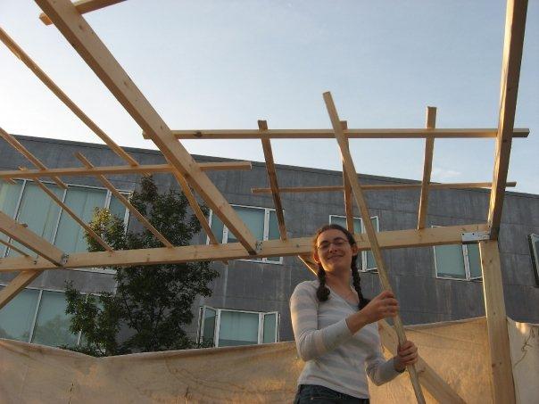 IF YOU BUILD IT... Deborah Thompson 07 building a sukkah at Brandeis last month. The Boston-area university is one of the most popular for Shalhevet alumni, and has everything Pico-Robertson has including large numbers of students observing holidays and Shabbat.