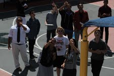Students watch Space Shuttle from middle school yard
