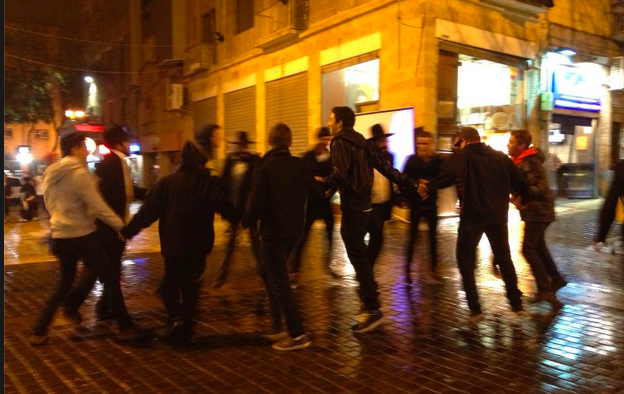 HOME: Shalhevet seniors danced with rabbis on Jerusalem's Ben Yehuda Street after Shabbat April 20. It was a relief after two weeks in Poland.