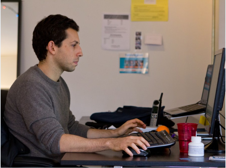 Josh Abrams at his desk in the Manhattan offices of Tutorspree, a company he co-founded, where he is Chief of Operations.