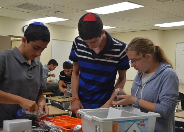 LAB: From left, Kian Marghzar, Mark Miller and Eliana Hjortzberg Litov at CIJE Sept. 12