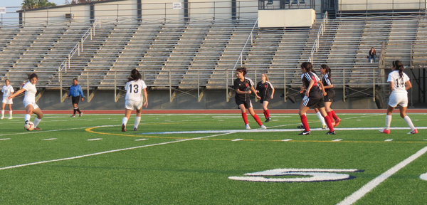 DEFENSE: Shalhevet Firehawks defend against St. Paul's High School's offensive attack.