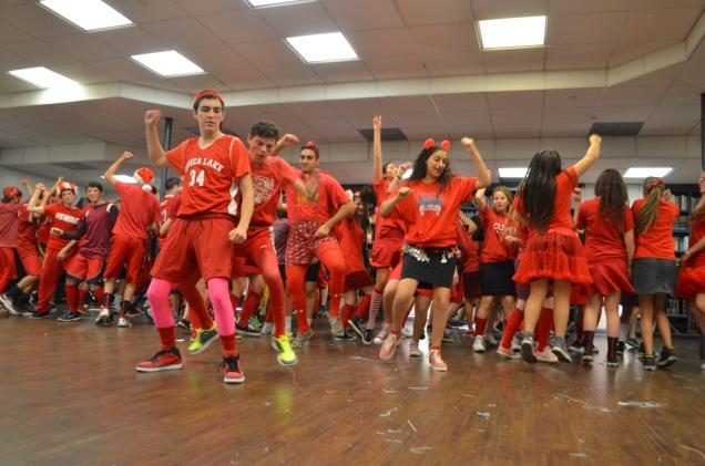 JUMP: After performing its winning song, the Red Team danced to the old classic song Jump on it, with a special spotlight on sophomores Jacob Dauer (center-left) and Micah Gill (behind Jacob).  