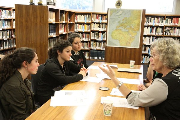 (www.shalhevetlamothfellows.weebly.com) 


LEARNING: Seniors Liat Bainvoll, Liat Menna and Sharona Sedighim hear from Dr. Rachel Korazim, a Holocaust education specialist, as part of the new Shalhevet-LAMOTH fellowship.  The girls visit the museum three times a week to learn about the Holocaust.  