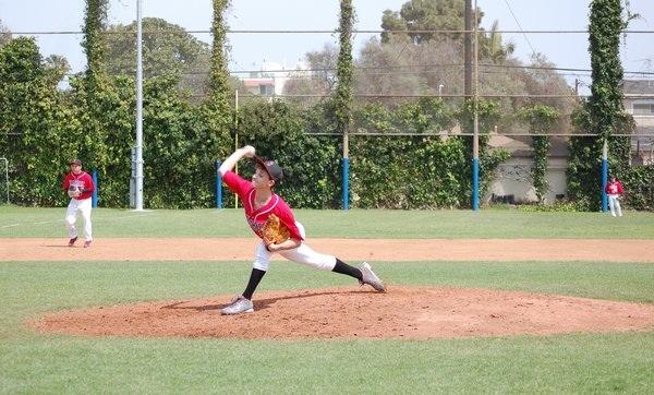 OUT! Freshman Ezra Hess has pitched against YULA in March.  The Firehawks finished the season with seven wins, six losses. 