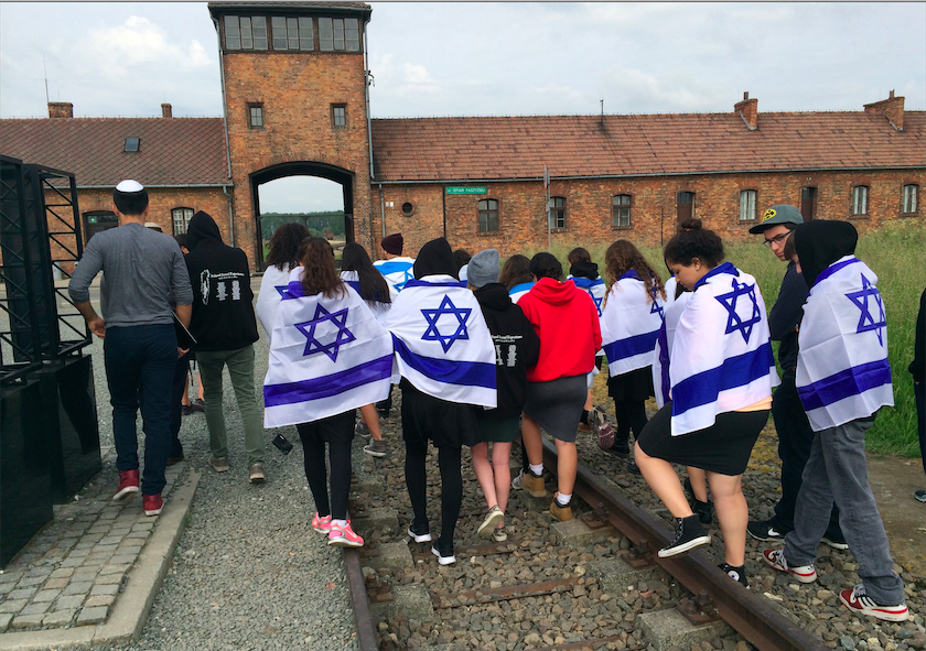 CLOSE%3A+Members+of+the+Class+of+2014+stayed+close+together+on+the+train+tracks+leading+into+Auschwitz%2C+