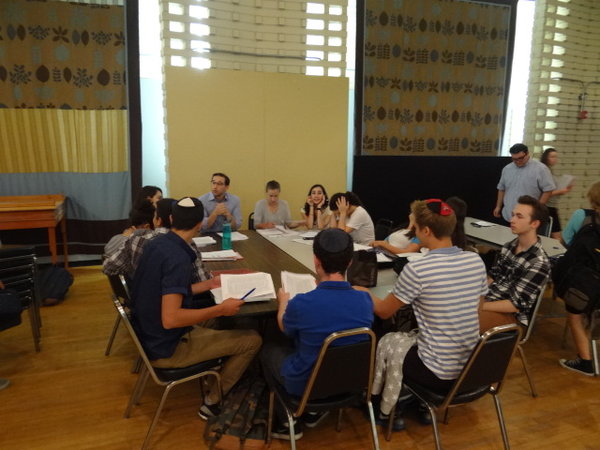 COLD: Rabbi Schwarzberg's 12th grade Gemara class learns in the JCC auditorium during heat wave week. Juniors and seniors were split up among the air conditioned rooms downstairs due to the temperature.