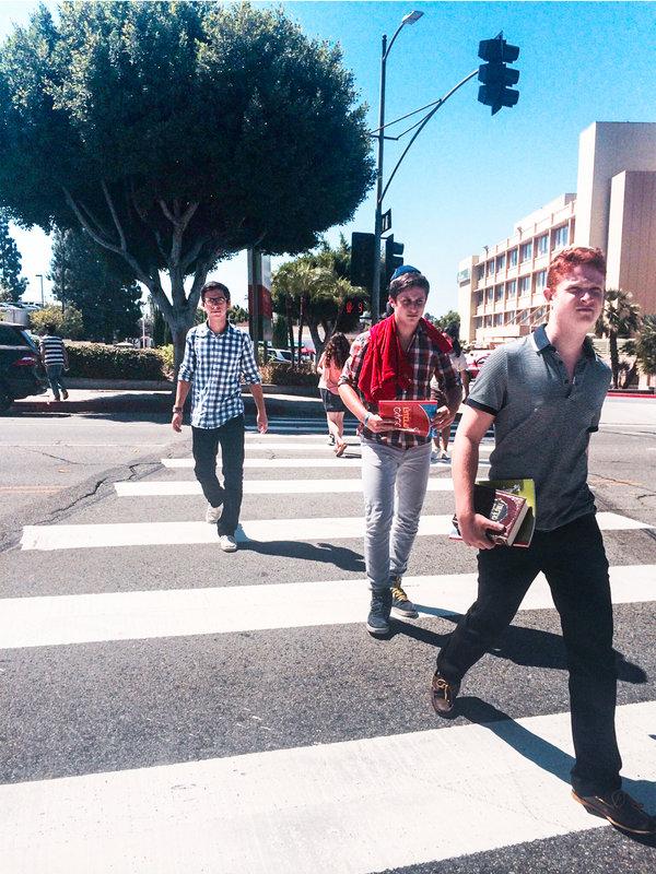 HOMEWARD: Jake Benyowitz, Nathan Benyowitz and Will Bernstein cross Olympic Boulevard on their way to the old student parking lot, across the street from the building on Fairfax