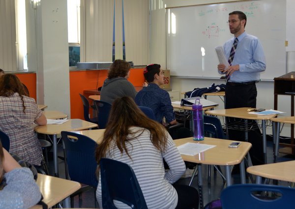 INSTRUCTING: Rabbi Jason Weiner took over Mrs. Segals Talmud class on October 30th. 