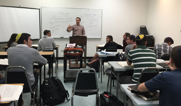 GEMARA: Rabbi Ari Schwarzberg teaches 10-12th graders during AGS, where students are learning Sanhedrin.