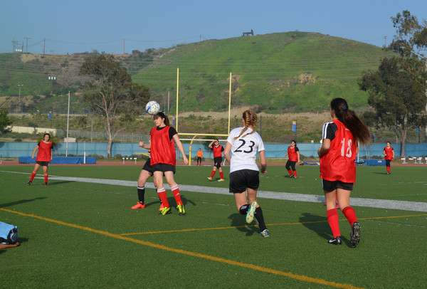 HEADS UP: Freshman Amberly Hershewe heads the ball in a 1-0 loss against YULA on Feb. 4.