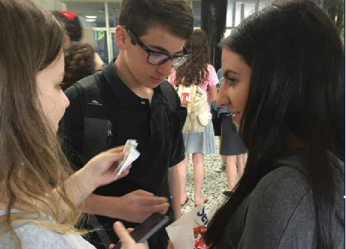 SWARM: Kayla Ablin, Aaron Cohen and Ariella Cohen bought and sold chocolate in the JCC lobby March 10.