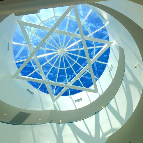 SHINE: Above the spiral staircase leading from the entrance foyer, a shallow glass dome framed with a star of David is one of many architectural features can be seen in the 26,000-square-foot new building.