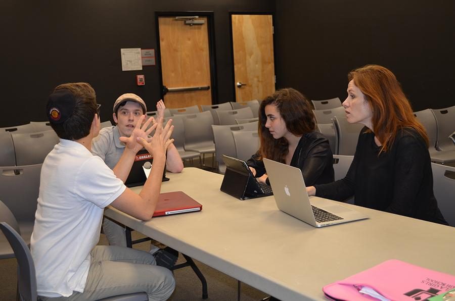 DEVISING: Ezra Fax, Eitan Schramm and Tania Bohbot work with Ms. Chase to produce two of the five one-act plays.
