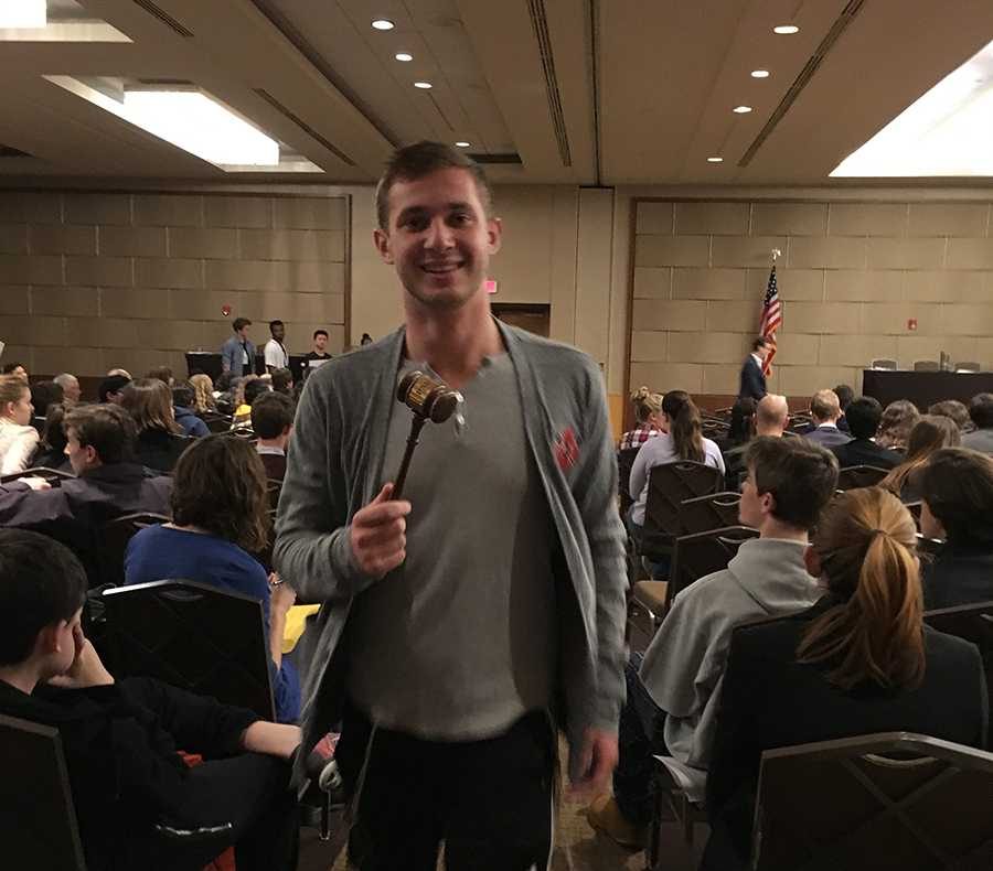 Model Congress Senator Boaz Willis happily returns to the Shalhevet delegation after being awarded a gavel in the Banking, Housing and Urban Affairs committee. His bill sought to impose rules for governors of the Federal Reserve.