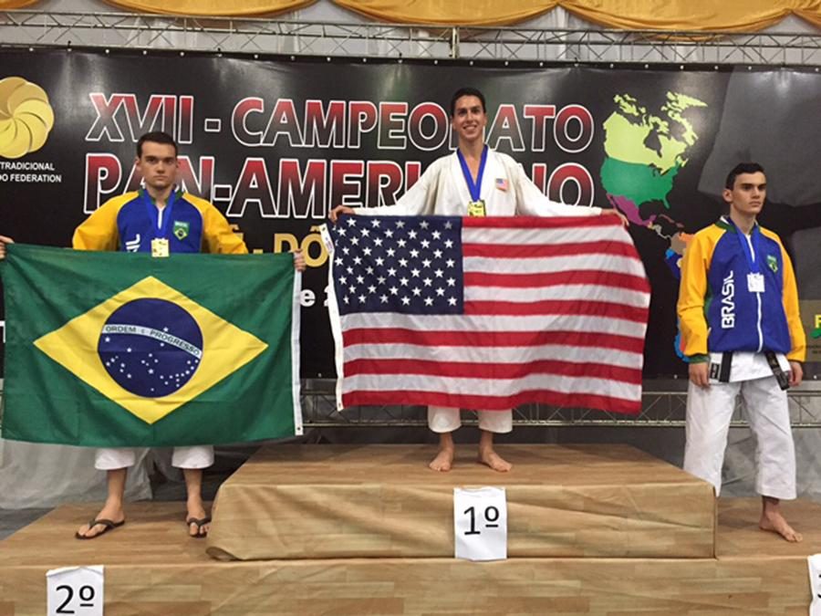 CHAMPION: Senior Daniel Soroudi accepts a gold medal for Team USA at the 17th Pan-American Karate Championships in Brazil. 