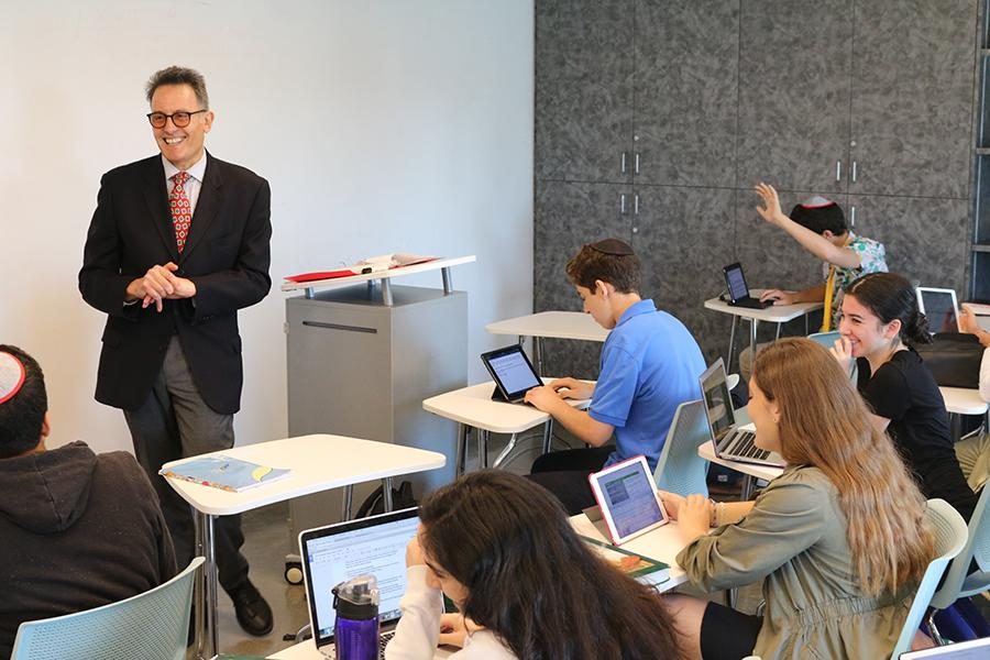 DAPPER: Dr. Yoss taught a ninth-grade class in the Music Room last week.  The Oxford-educated veteran history teacher also teaches American History and Humanities this year.