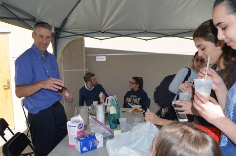OPEN: Dr. Amit served coffee to students in an open sided tent on the rooftop turf during his two-week residency in February.