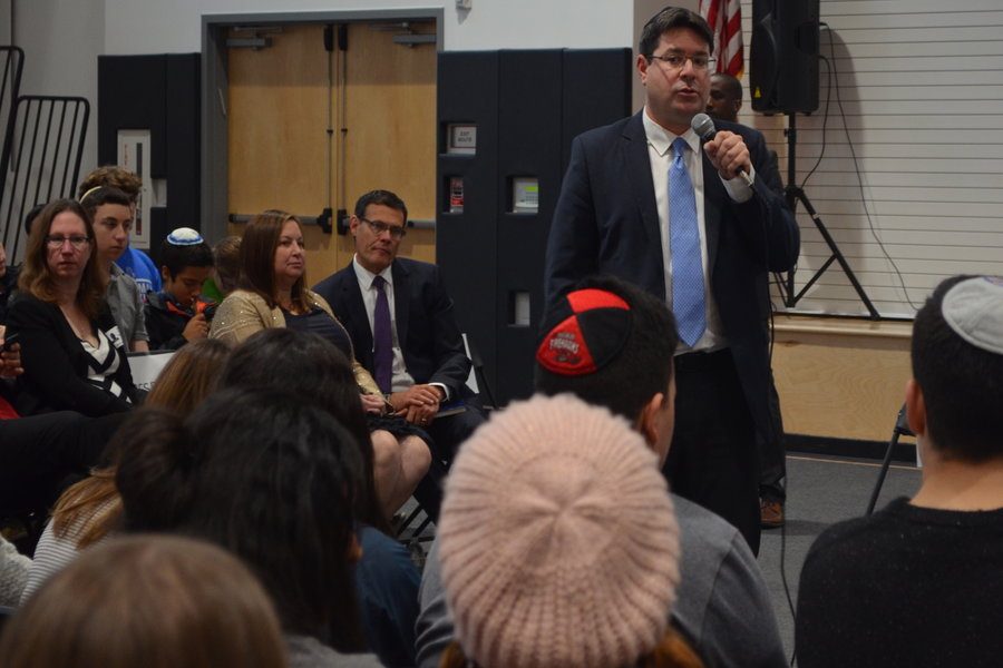BUSY: Israeli  Minister of Science, Technology and Space,  Ofir Akunis, spoke to an all-school assembly Feb. 8, as Consul General David Siegel looked on.  Minister Akunis was in the U.S. to work on research and space agreements.