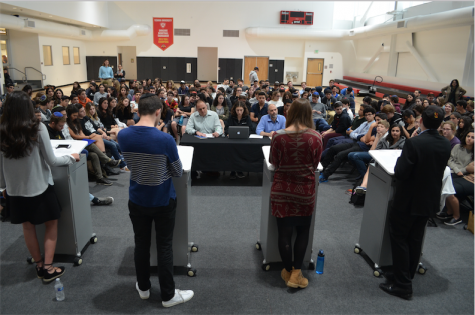 TABLE: From left, General Studies Principal Mr. Daniel Weslow, Hannah Jannol of the Boiling Point, and Dean of Students Mr. Jason Feld posed questions to candidates for Agenda Chair in the gym May 12. 