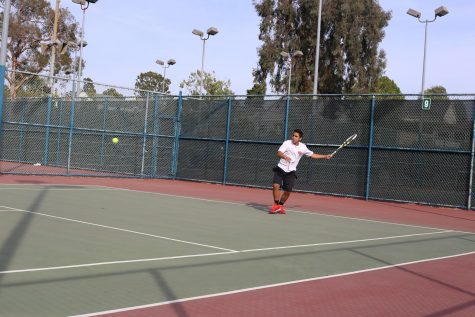 WINNERS: Sophomore Arman Marghzar is one of 13 players on the Firehawk tennis team.