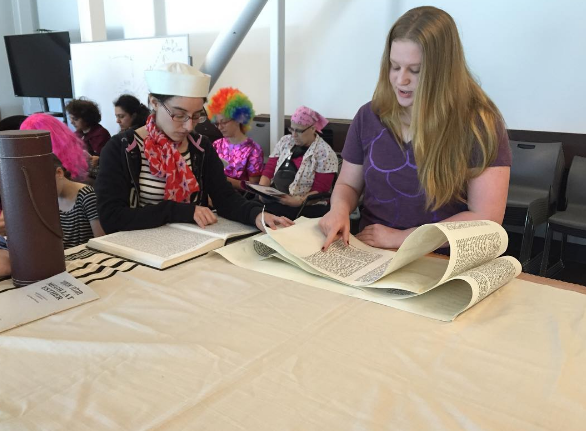 HISTORY: From top, freshman Abby Blumofe and alumna Sara Smith 04 read from Megillat Esther.