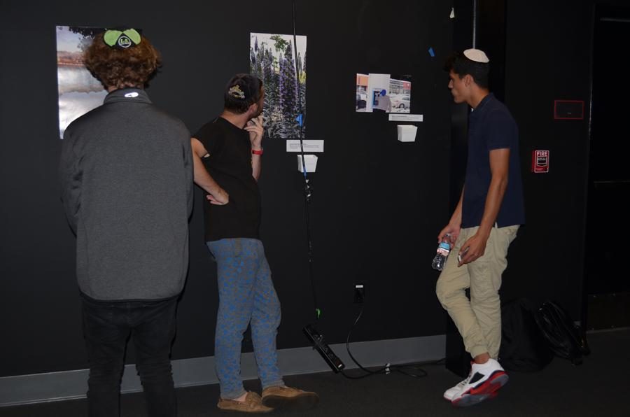 CLICK: Guests stroll through theWildfire Theater admiring student photography. The new club raised approximately $250 for ELEM, an Israeli organization that aids homeless teens. 