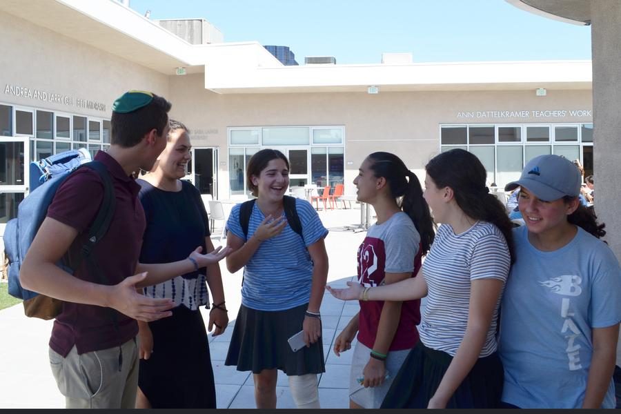 NEW HEIGHTS: Freshmen, here on the roof the first week of school, should remember to be themselves and take their time