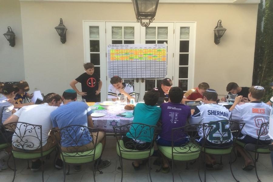 GATHERING%3A+Boys+in+the+Just+Community+League+congregated+at+Alec+and+Jordan+Fields+house+for+the+Fantasy+Football+draft+Sept.+4.+They+were+encouraged+to+wear+their+favorite+players+jerseys.+