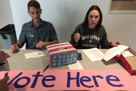 TRUMPED: Ezra Hess and Bailey Mendelson collected ballots in the second-floor hallway during the mock presidential election at lunch Nov. 8.