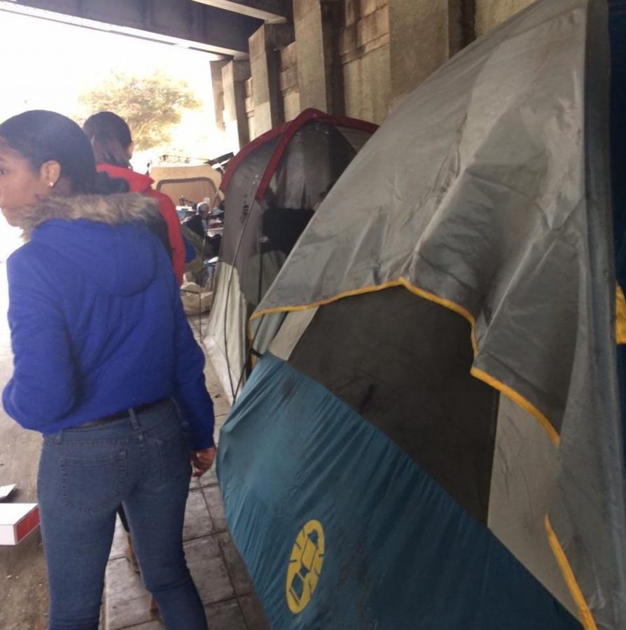 UNDERNEATH: Juniors Rosie Wolkind and Maia Zelkha visited a homeless encampment beneath a Downtown freeway to distribute cameras. They have received four in return so far.