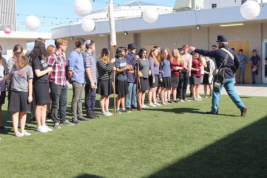 ORDERS: Students from all grades lined up in military formation on the rooftop turf Nov. 9, reenacting roles in a South Carolina regiment during the Civil War. The event was brought to the school by history teacher Dr. Keith Harris.