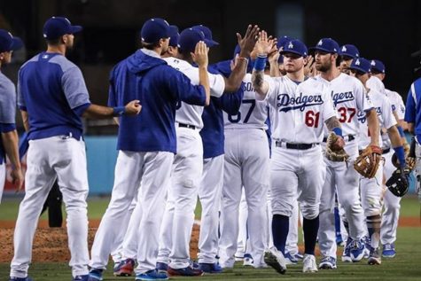 DODGERS: Players rejoice after their 9-3 victory over the Padres on September 25.