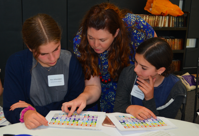BLOCK: Dean of Academic Affairs Ms. Aviva Walls showed freshmen Noa Silberstein, left, and Layla Dauer how to color-code her schedule at Freshman Orientation Aug. 24.