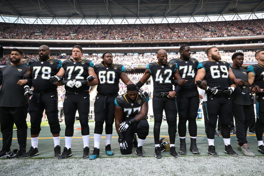 Ravens and Jaguars Players Kneel and Lock Arms During National Anthem