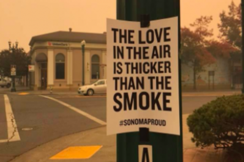 SMOKE: In Santa Rosa, in Northern California, 2,834 homes burned in devastating October fires. Schools were closed for three weeks, students fell behind in their APs, and college plans were changed. Above, a hopeful sign in downtown Santa Rosa.