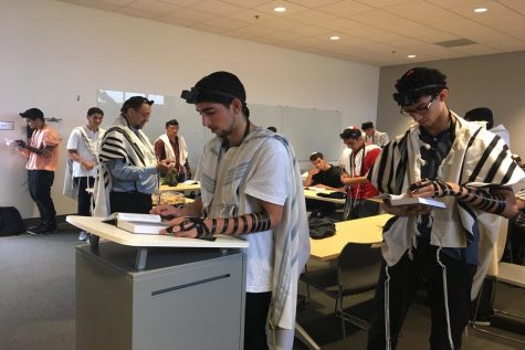 LEADING: Senior Benny Zaghi who started the Sephardic Minyan has help leading it from his classmate Ilan Bouskila (right), Rabbi Bouskila -- Ilan's father (left), and juniors Isaac Kahtan and Sam Navon.