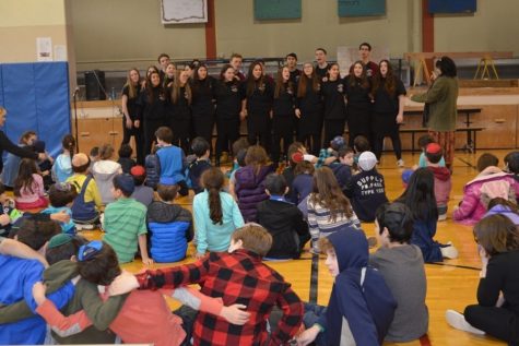 SHARING: Students at Seattle Hebrew Academy heard the Choirhawks Chanukah songs Dec. 14. The next day the group sang at Northwest Yeshiva High School, where Mr. Jason Feld is head of school. 