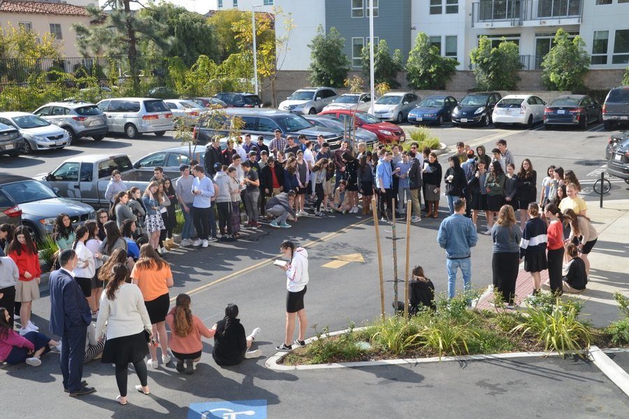 HONOR: About 90 students and faculty sang songs and read psalms in the parking lot March 14, 2018 to honor victims of the high school shooting in Parkland, Fla., that killed 14 students and three teachers. About half the school stayed in class.