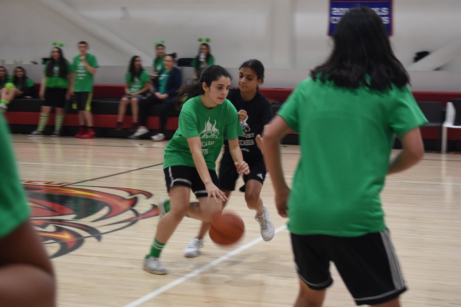WINNER: Firehawk basketball star Maital Hiller heads for the basket as freshman Sarah Namvar catches up.