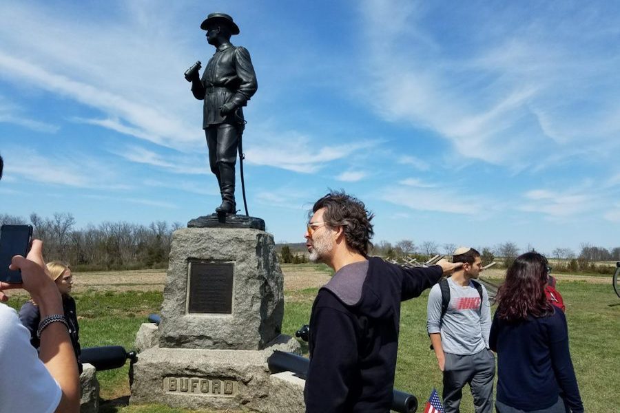   BATTLEGROUND: In Pennsylvania, History teacher Dr. Keith Harris explained the scene at the monument to Union Major General John Buford, who chose the site for the battle of Gettysburg, recognizing its strategic importance. 