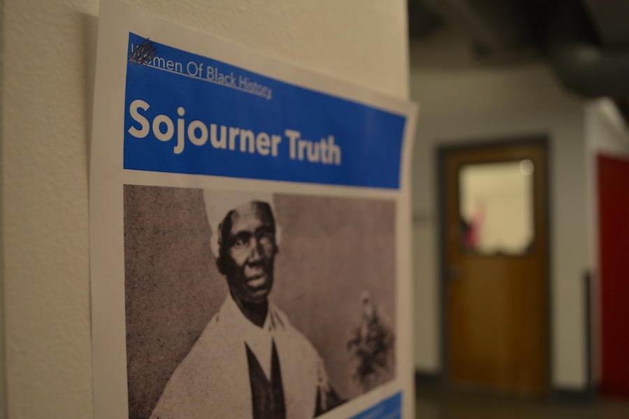REMEMBRANCE: At top left corner of poster, the “Wo” is crossed out in “Women of Black History.” It was one of several that were vandalized in second-floor hallways.