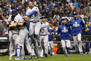 CELEBRATE:    Dodgers celebrated on the field in Milwaukee after their division-winning defeat of the Brewers Oct. 20. 