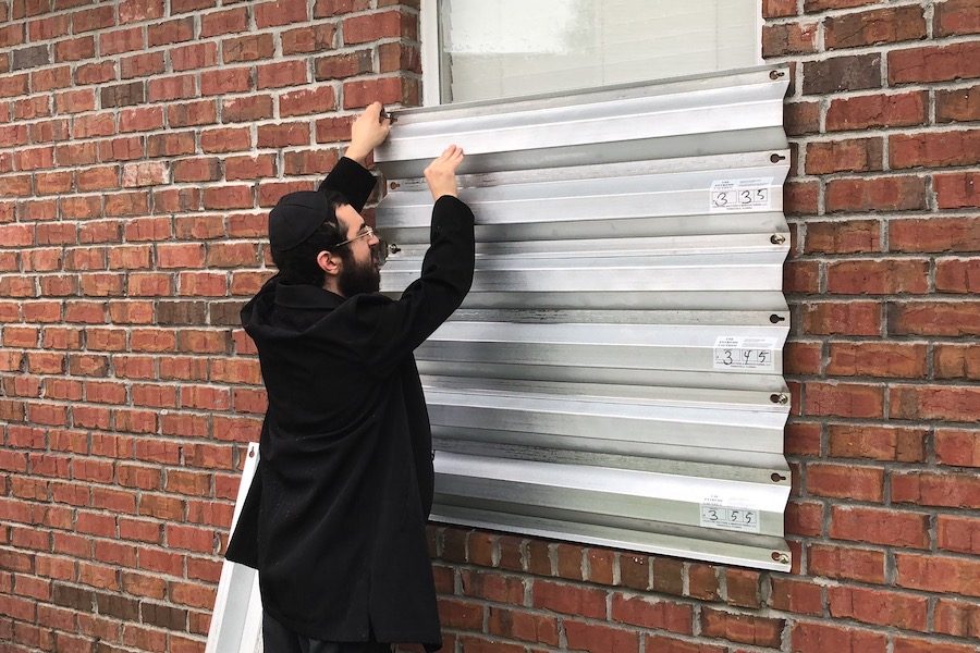 SAFE:  Rabbi Mendel Danow attached covered the windows of the Chabad Jewish Center Pensacola with metal siding to protect from the winds of Hurricane Michael.