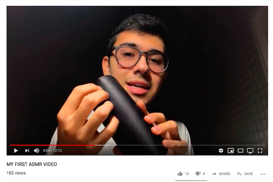 ASMR:   Senior Josh Sarir starts his ASMR video by tapping with his finger on his glasses case while speaking in a low, whispery voice. The tapping produces soothing sounds which have been found to lower viewers’ heart rates. Screenshot from youtube.com