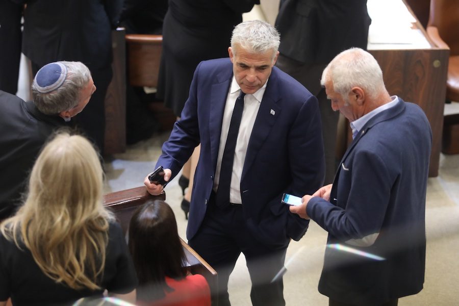 GOVERNING:   Israel’s parliament meeting in the Knesset in December before it was adjourned until after new elections. At center is Yair Lapid, leader of the Yesh Atid party 
