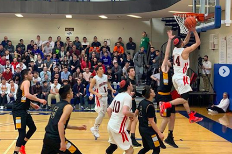 LEAP:    Above, senior Jeremy Ashegian scores on a layup as Shalhevet beats YULA 46-38 in the first round of the Sarachek tournament Friday at Yeshiva University in New York. The Firehawks went on to defeat the DRS Wildcats on Sunday and will face Mogen David of Brooklyn  in the championship game today.