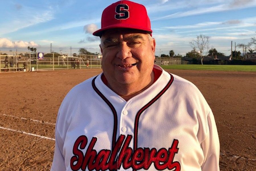 WIN:   Coach Gunches smiles for the camera following Shalhe- vet’s 10-0 win over Environmental Charter Feb. 28. It was the Firehawks first victory this season after starting off 0-2.
 Photo by Alex Rubel